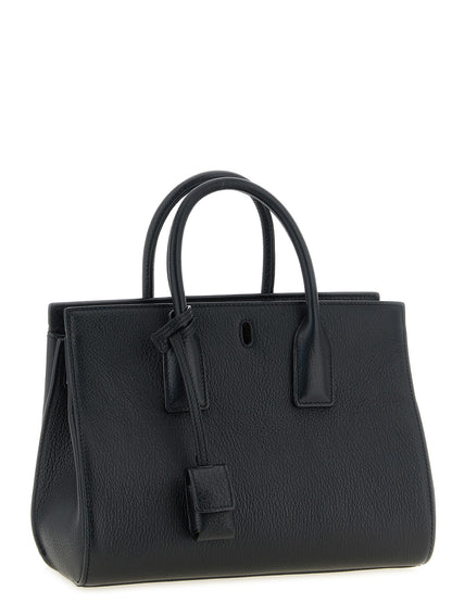 East West Handbag by Saint Laurent for women in viscose goat leather & fur black features an refined silhouette, showcasing a secure , ample , and versatile adjustable-strap & handle for a sophisticated refined aesthetic.