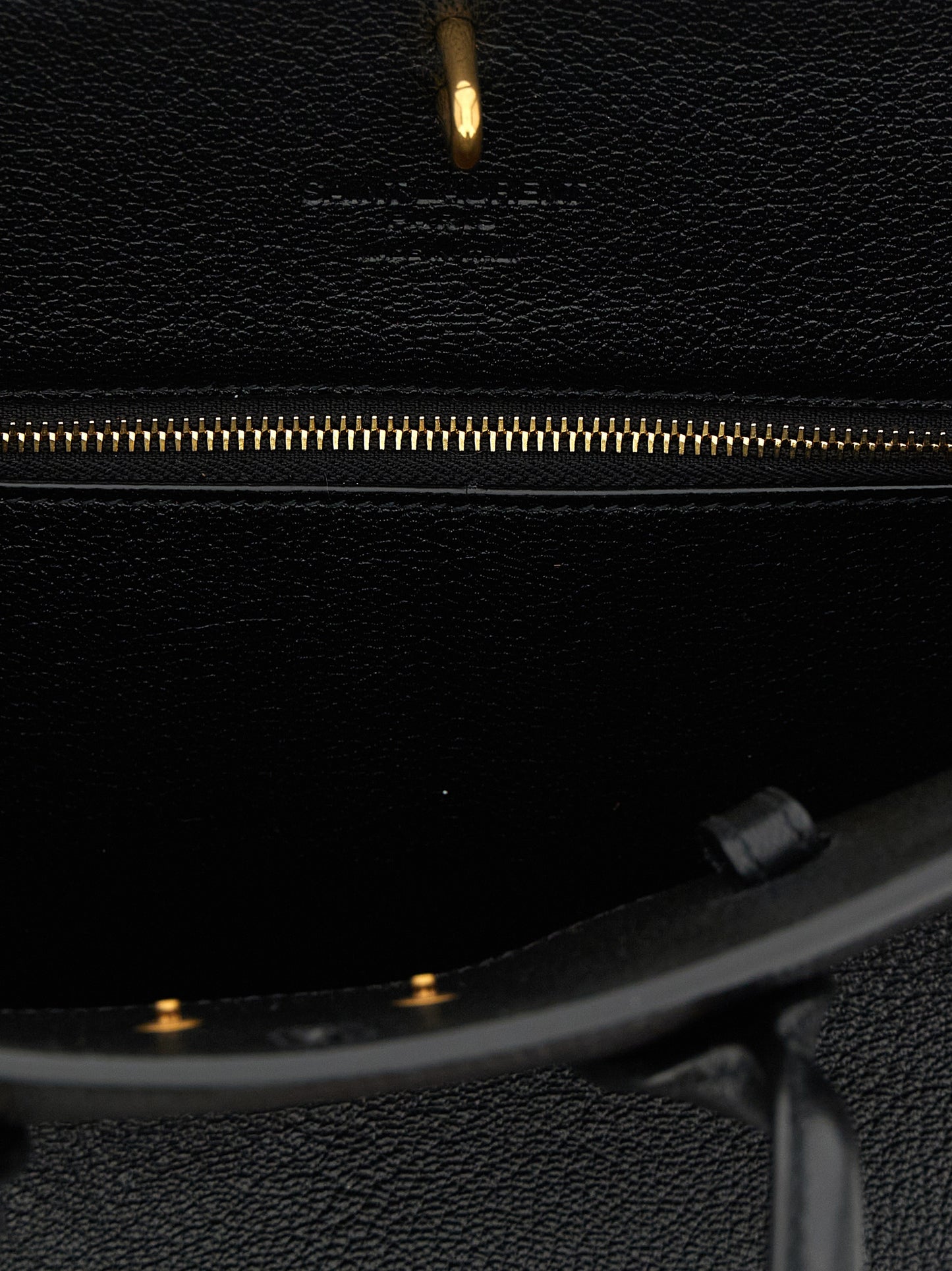 East West Handbag by Saint Laurent for women in viscose goat leather & fur black presents a ornamental silhouette, showcasing a secure , ample , and versatile adjustable-strap & handle for a ornamental finish.