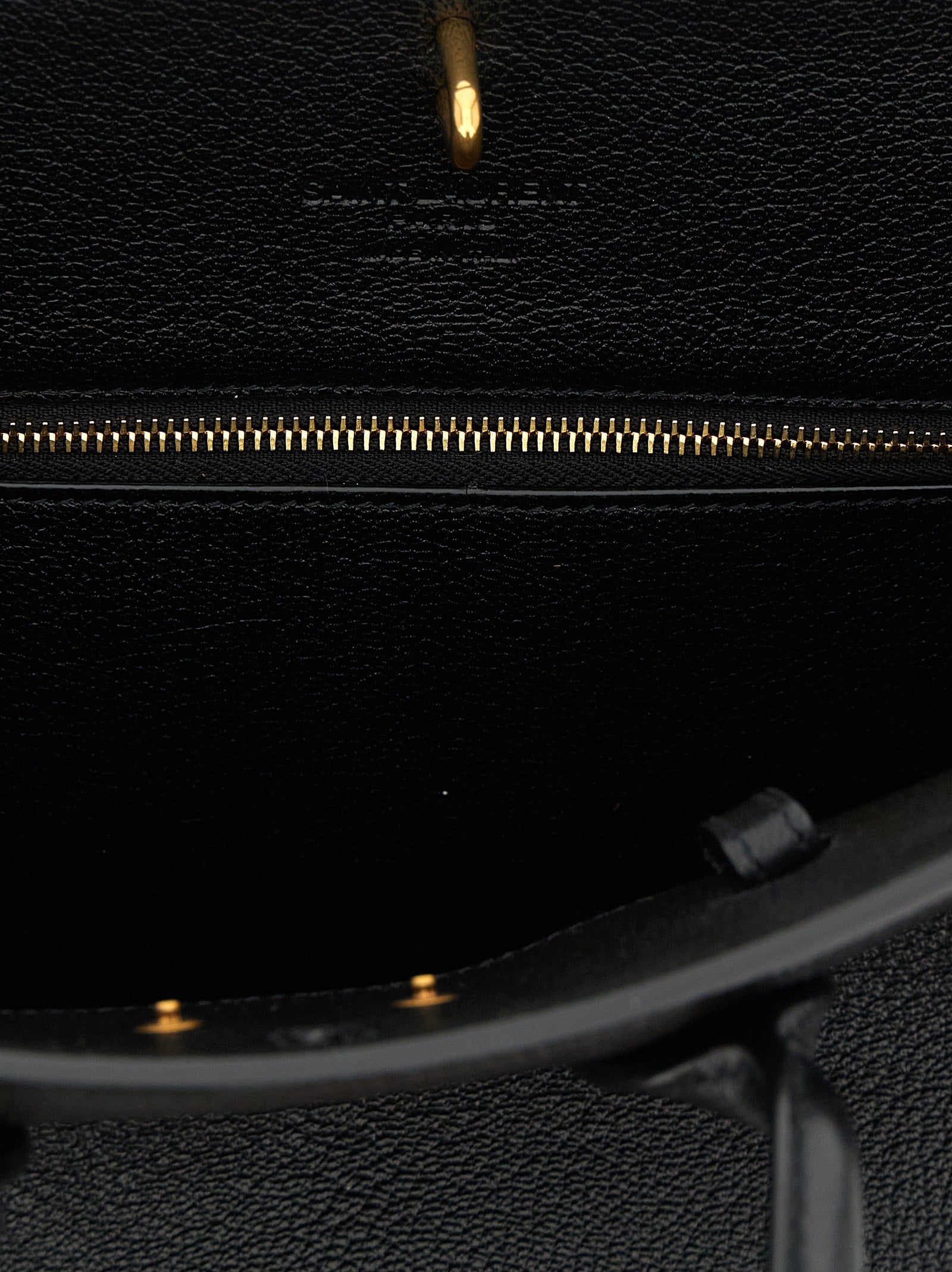 East West Handbag by Saint Laurent for women in viscose goat leather & fur black presents a ornamental silhouette, showcasing a secure , ample , and versatile adjustable-strap & handle for a ornamental finish.