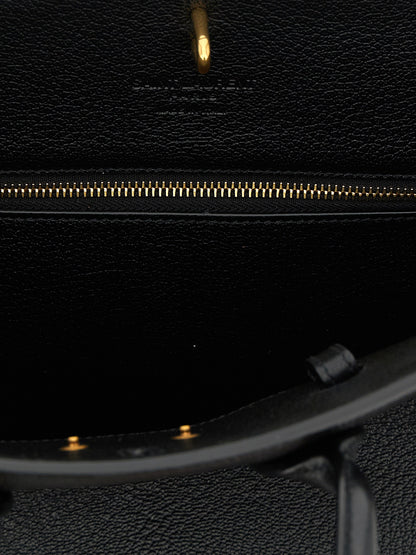East West Handbag by Saint Laurent for women in viscose goat leather & fur black presents a ornamental silhouette, showcasing a secure , ample , and versatile adjustable-strap & handle for a ornamental finish.