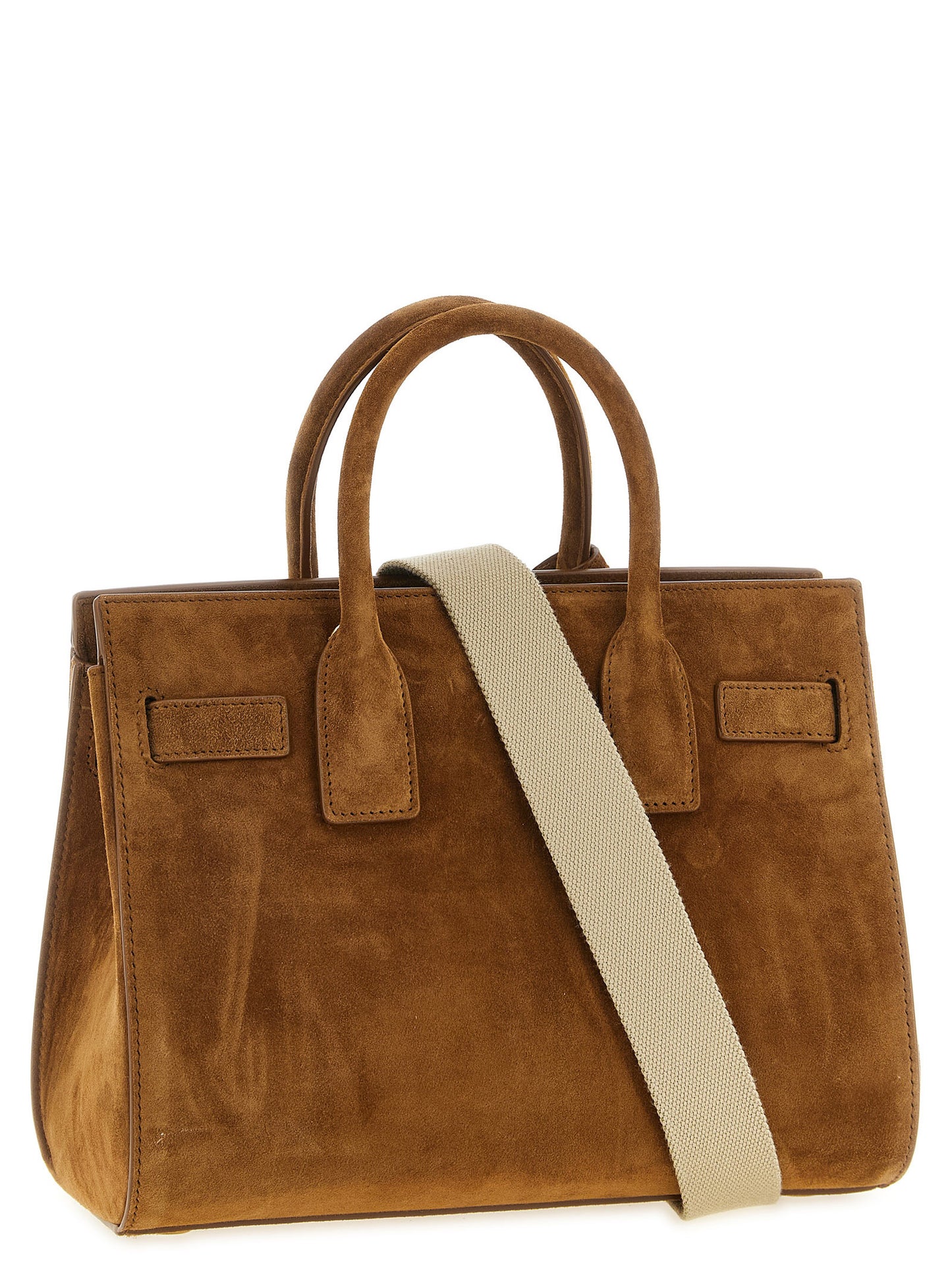 This Small East West Handbag by Saint Laurent for women in suede calfskin leather and brown & signature presents a sculptural silhouette featuring a secure , ample , and versatile adjustable-strap & handle for a sculptural finish.