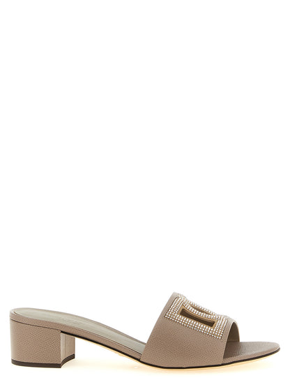 Mules Sandals Flat Shoes by Dolce & Gabbana for women in suede calfskin & goat leather gray & signature showcases a dynamic silhouette, artfully capturing Women's Suede Calfskin & Goat Leather Mules Sandals Flat Shoes through its distinctive and elegant .