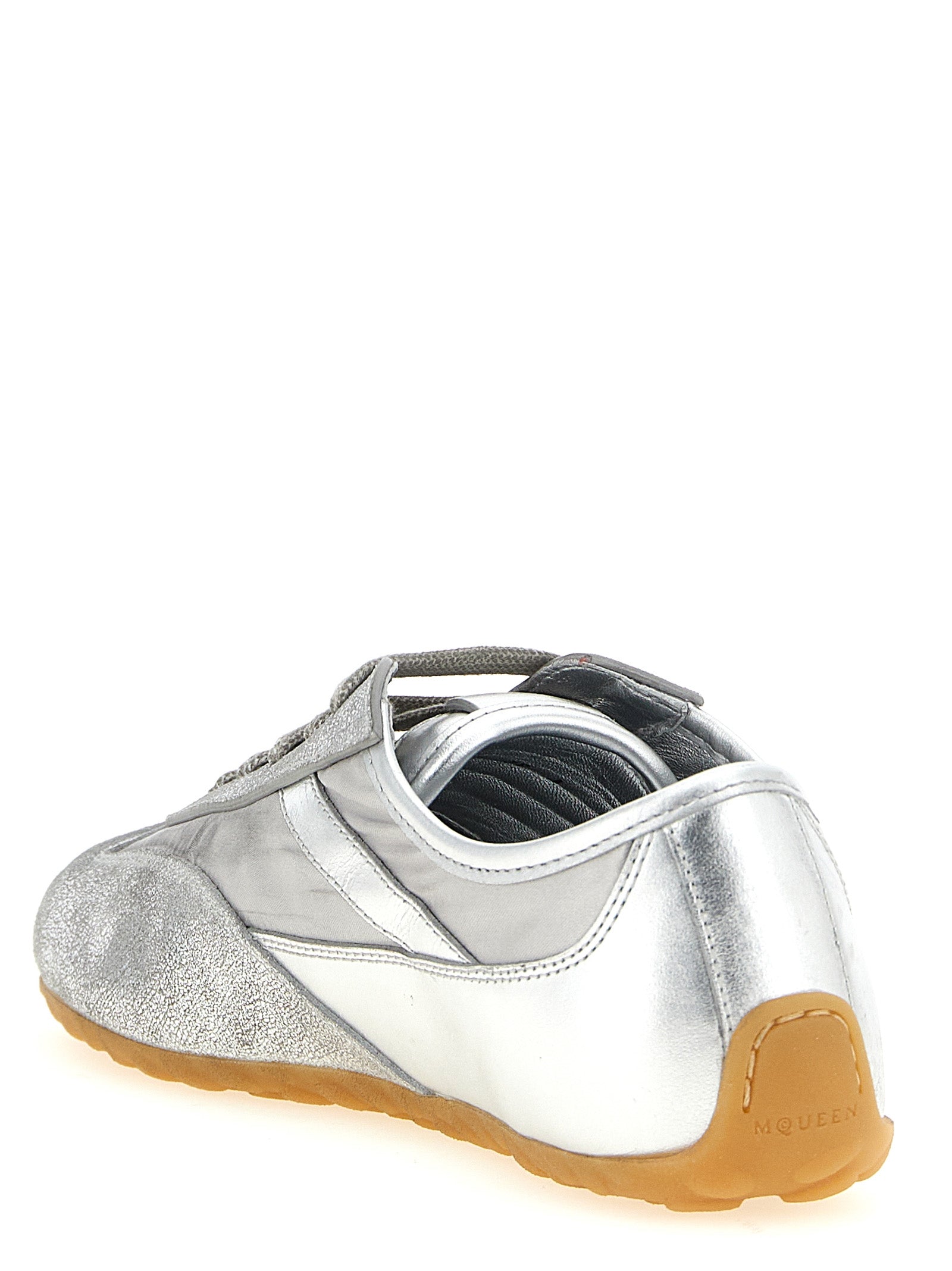 Athletic Sneakers by Alexander McQueen for women in nylon leather silver showcases an impeccable silhouette, defined by an impeccable athletic style design that perfectly captures the essence of the Women's Athletic Nylon Leather Sneakers.