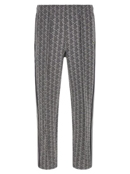 Joggers by Lacoste for men in polyamide polyester & cotton gray, jacquard & monogram features a polished silhouette with a polished straight-leg, reaching a polished long and finished with a polished .