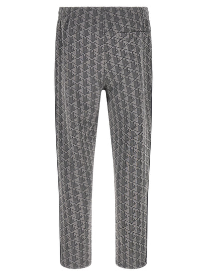 Joggers by Lacoste for men in polyamide polyester & cotton gray, jacquard & monogram features an sartorial straight-leg and long with a cut for a sartorial finish.