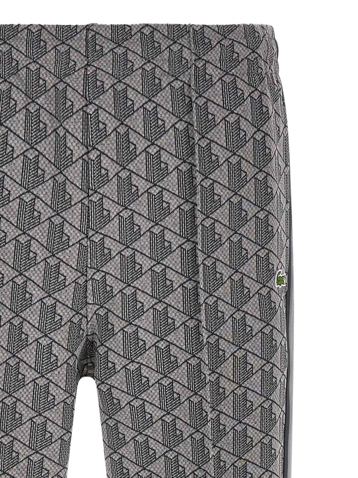 Joggers by Lacoste for men in polyamide polyester & cotton gray, jacquard & monogram features a refined silhouette with a refined straight-leg, defined by a and a refined long for a refined finish.