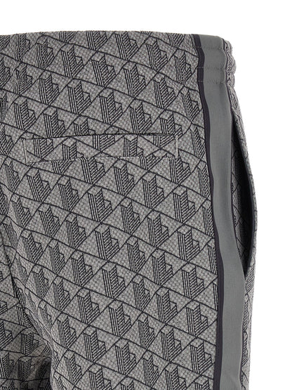 Joggers by Lacoste for men in polyamide polyester & cotton gray, jacquard & monogram presents a refined pantology silhouette, artfully defined by a refined pantology straight-leg, long, and a sophisticated .