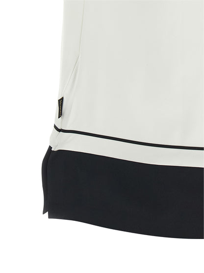 Polo Shirt by GOLDBERGH for women in stretch polyester bicolour, black & white presents a crisp silhouette, artfully detailed with a crisp and crisp .