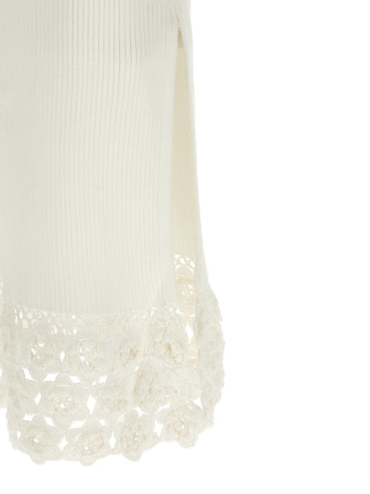 Dress by Ganni for women in organic cotton & polyamide white features an magnificent silhouette, artfully detailed with a magnificent and that flows into an magnificent long.
