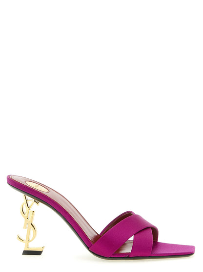 Stiletto Mules Sandals by Saint Laurent for women in viscose silk satin & leather fuchsia features an architectural design from the Cassandre Women's Viscose Silk Satin & Leather Stiletto Mules Sandals collection, defined by a architectural stiletto and for a architectural finish.
