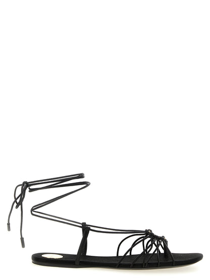 Flat Sandals by Saint Laurent for women in lamb leather black features an exquisite silhouette, showcasing the exquisite Cassandre Women's Lamb Leather Flat Sandals with a flat and almond toe style.