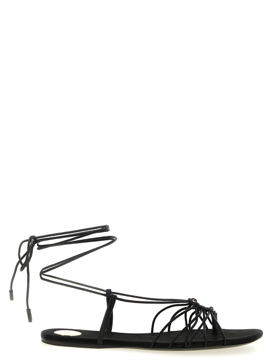 Flat Sandals by Saint Laurent for women in lamb leather black features an exquisite silhouette, showcasing the exquisite Cassandre Women's Lamb Leather Flat Sandals with a flat and almond toe style.