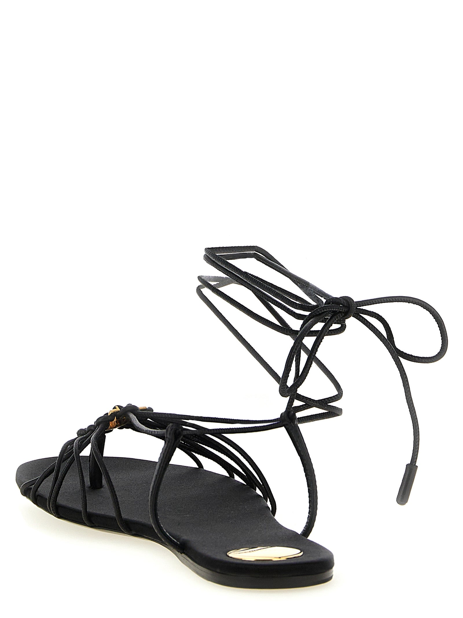 Flat Sandals by Saint Laurent for women in lamb leather black presents a sculptural silhouette, showcasing the Cassandre Women's Lamb Leather Flat Sandals design with a sculptural flat and almond toe style for a premium look.