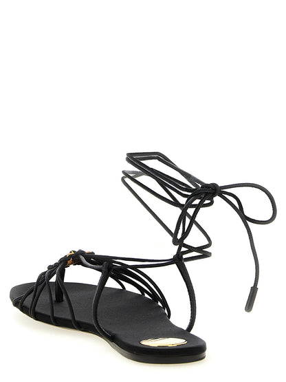 Flat Sandals by Saint Laurent for women in lamb leather black presents a sculptural silhouette, showcasing the Cassandre Women's Lamb Leather Flat Sandals design with a sculptural flat and almond toe style for a premium look.