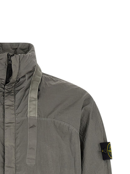 Hooded Bomber Jacket by Stone Island for men in nylon gray features an contemporary silhouette, showcasing a sophisticated hooded neckline and contemporary hooded for a truly refined look.