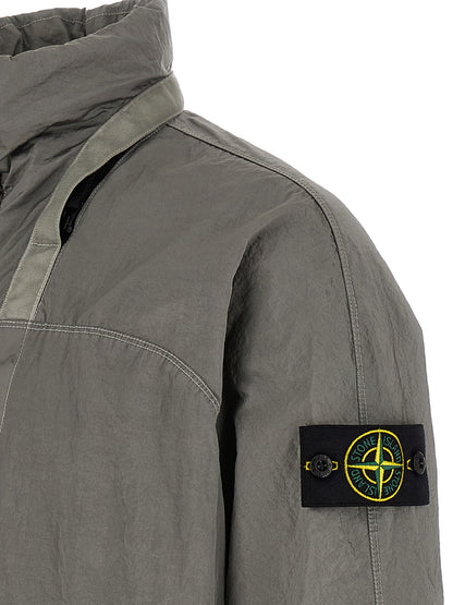 Hooded Bomber Jacket by Stone Island for men in nylon gray features a dramatic silhouette, showcasing a sophisticated and distinctive hooded for a dramatic aesthetic.