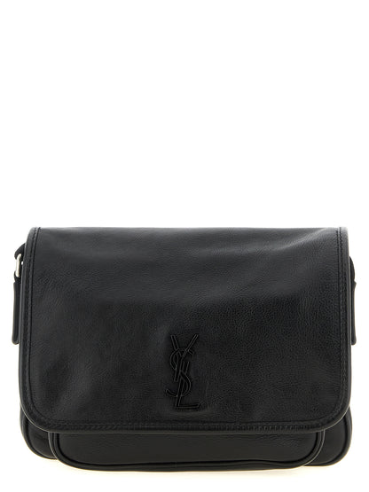 Small Crossbody Messenger Bag by Saint Laurent for men in calfskin leather black features an fashionable Cassandre Essence Niki Calfskin Leather Small Crossbody Messenger Bag design with a fashionable flap & magnetic, ample , and versatile crossbody-strap, shoulder-strap & adjustable-strap for a sophisticated finish.