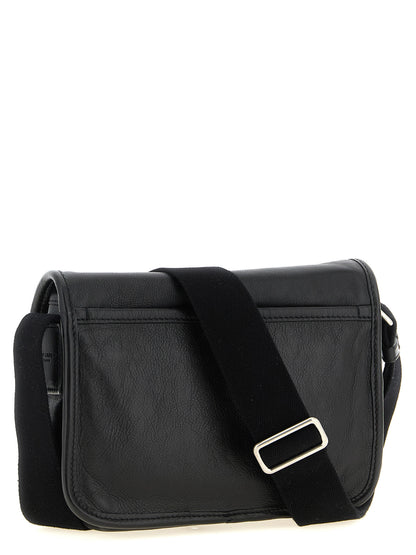 Small Crossbody Messenger Bag by Saint Laurent for men in calfskin leather black features a statement-making Cassandre Essence Niki Calfskin Leather Small Crossbody Messenger Bag design with a secure flap & magnetic, statement-making , and versatile crossbody-strap, shoulder-strap & adjustable-strap for a sophisticated look.