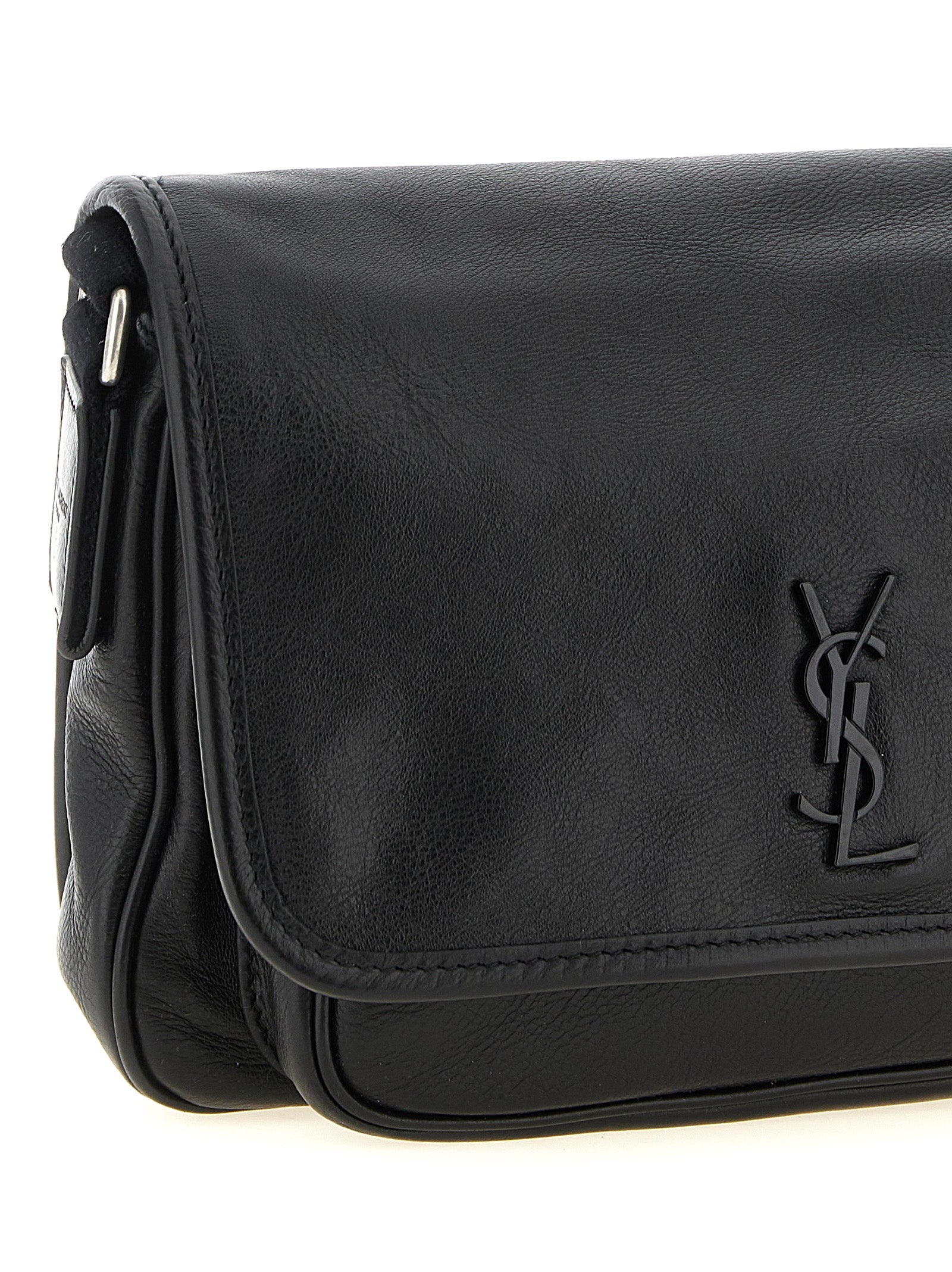 Small Crossbody Messenger Bag by Saint Laurent for men in calfskin leather black features a artisanal Cassandre Essence Niki Calfskin Leather Small Crossbody Messenger Bag design with a secure flap & magnetic, ample , and versatile crossbody-strap, shoulder-strap & adjustable-strap for a artisanal finish.