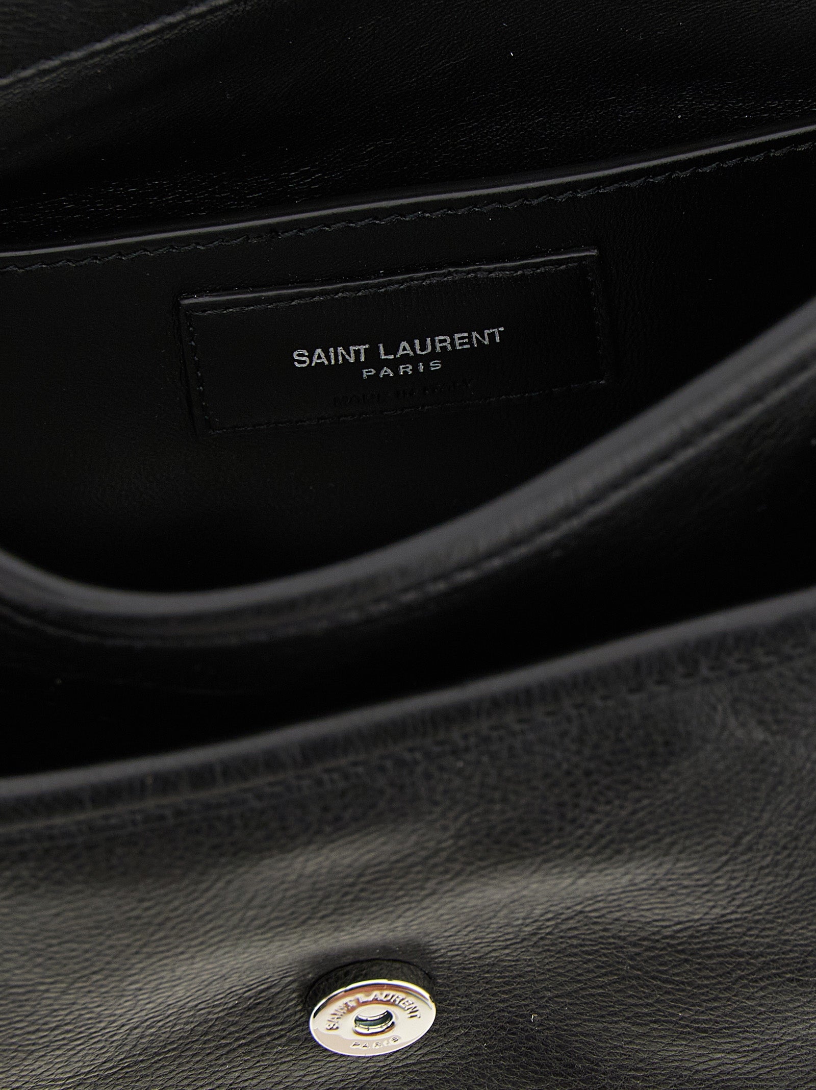 Small Crossbody Messenger Bag by Saint Laurent for men in calfskin leather black showcases a stylish Cassandre Essence Niki Calfskin Leather Small Crossbody Messenger Bag design, featuring a secure flap & magnetic and ample with versatile crossbody-strap, shoulder-strap & adjustable-strap for a stylish look.