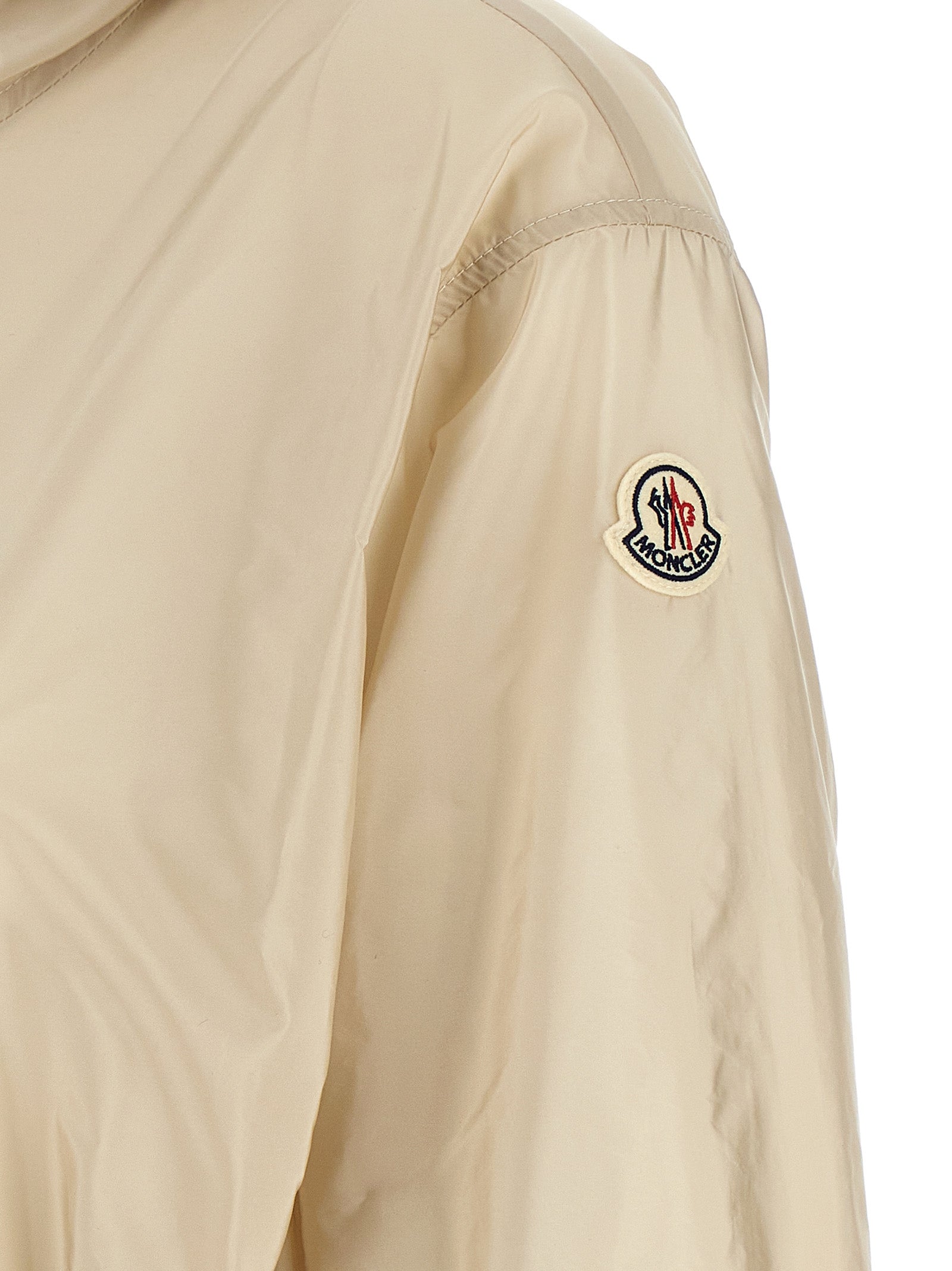 Hooded Windbreaker Jacket by Moncler for women in nylon felt beige presents a resilient silhouette, artfully detailed with a sophisticated and functional pockets, hooded & windproof for a resilient finish.