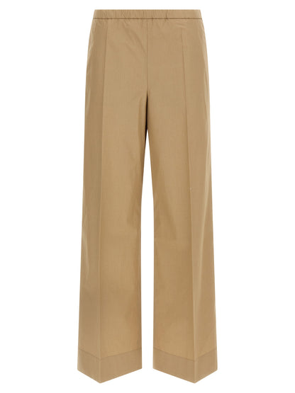 Trousers by Moncler for women in cotton beige presents a smart silhouette, meticulously detailed with a smart straight & wide, a smart long, and a smart .