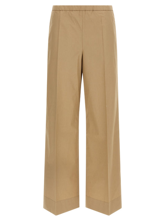 Trousers by Moncler for women in cotton beige presents a smart silhouette, meticulously detailed with a smart straight & wide, a smart long, and a smart .