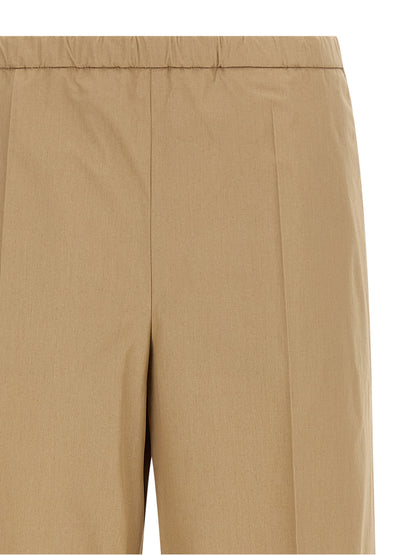 Trousers by Moncler for women in cotton beige features an on trend silhouette, showcasing a sophisticated straight & wide with a long and for an on trend finish.