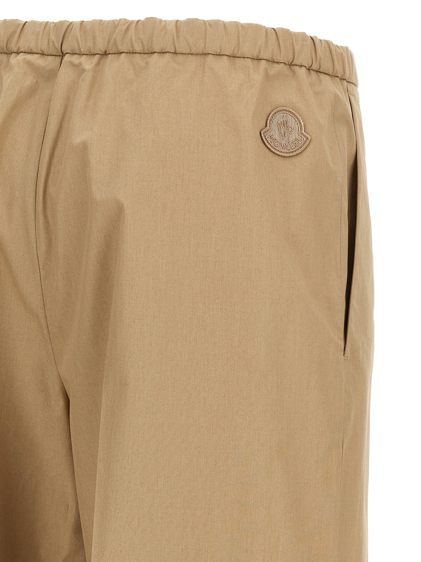 Trousers by Moncler for women in cotton beige features a sculptural silhouette, showcasing a sculptural straight & wide and long with a sophisticated for a sculptural finish.