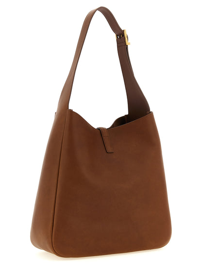 Large Shoulder Clutch Bag by Saint Laurent for women in suede calfskin leather brown features a distinguished silhouette, showcasing a secure and distinguished with versatile shoulder-strap, adjustable-strap & handle for a distinguished finish.