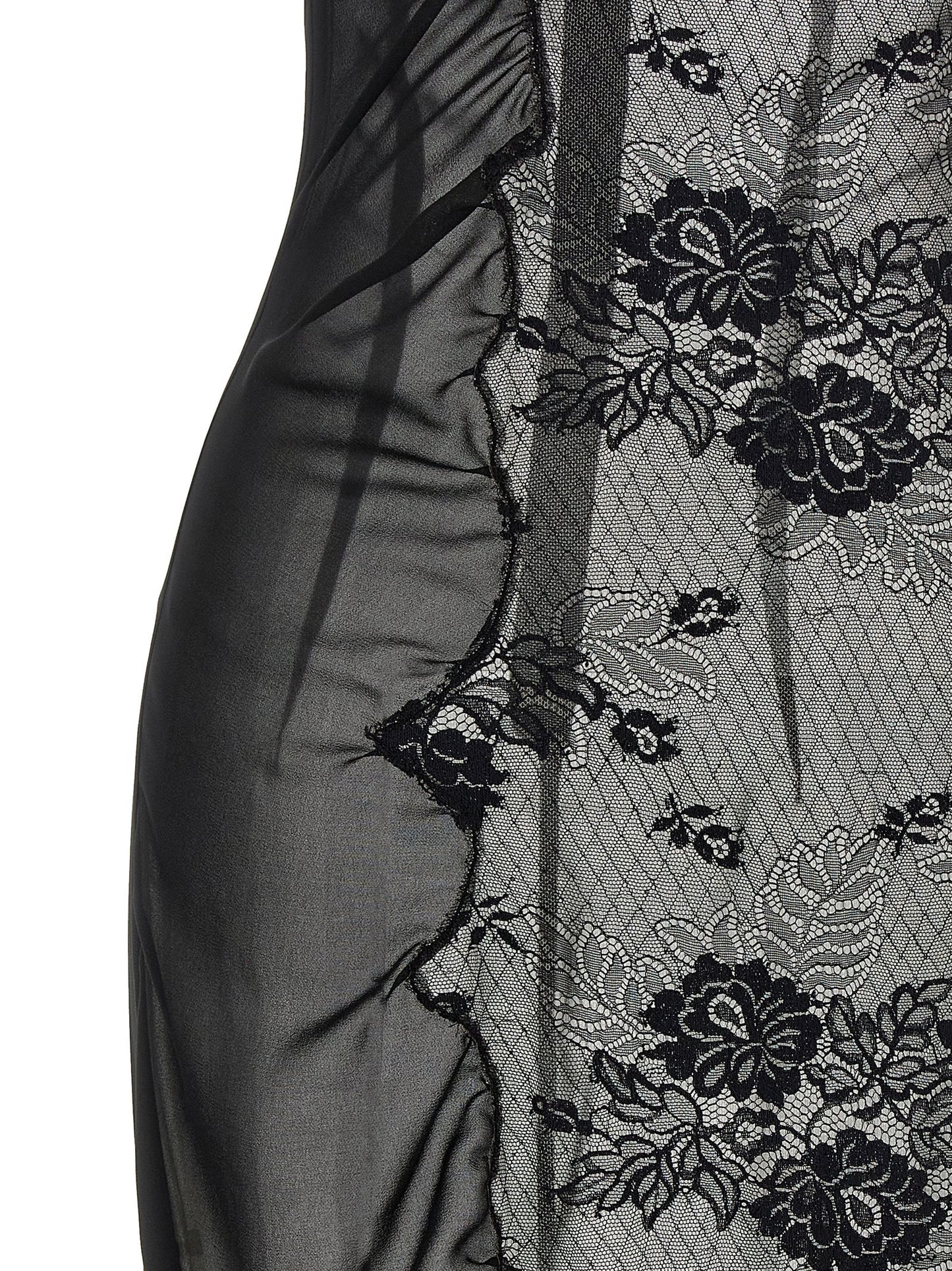 Dress by The Attico for women in polyamide cotton black presents a sinuous silhouette, showcasing a sophisticated high-neck neckline and detailed with a sinuous midi short for a refined finish.