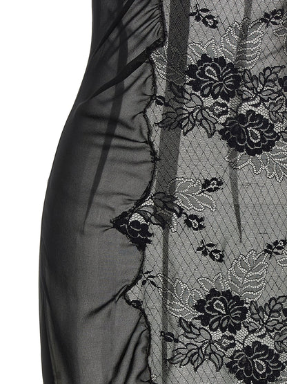 Dress by The Attico for women in polyamide cotton black presents a sinuous silhouette, showcasing a sophisticated high-neck neckline and detailed with a sinuous midi short for a refined finish.