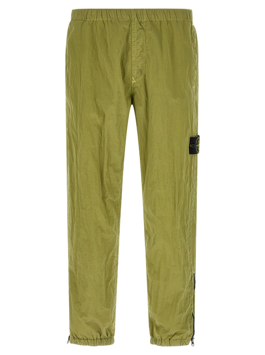Joggers by Stone Island for men in nylon bicolour & green features an sartorial tapered-leg and long with a cut for a sartorial finish.