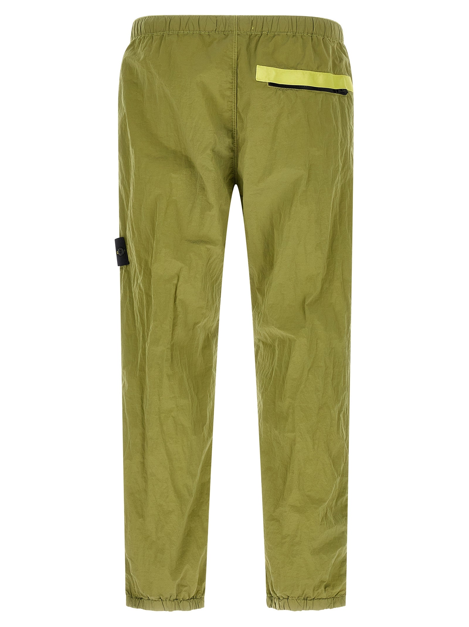 Joggers by Stone Island for men in nylon bicolour & green features an sophisticated and tapered-leg with a precise long, creating a sophisticated and sophisticated silhouette.