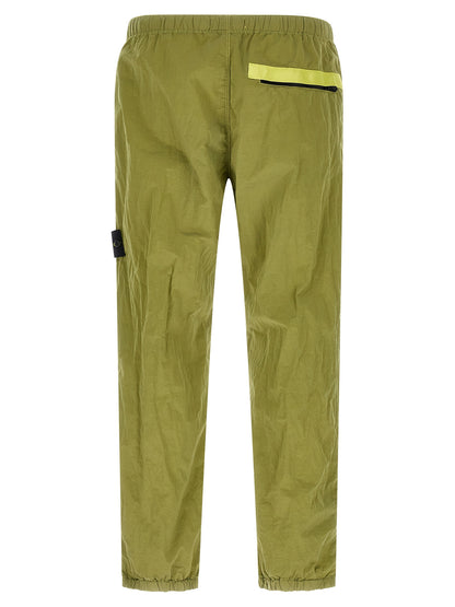Joggers by Stone Island for men in nylon bicolour & green features an sophisticated and tapered-leg with a precise long, creating a sophisticated and sophisticated silhouette.