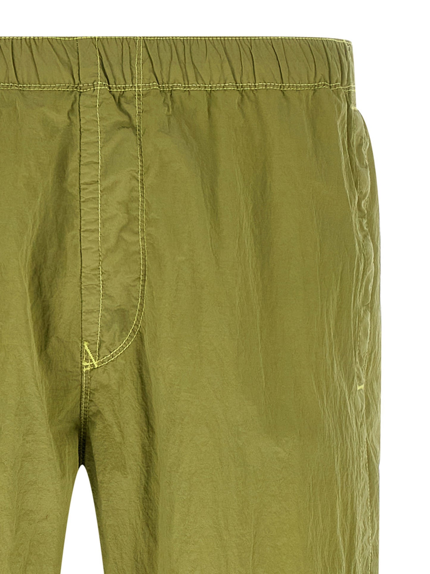 Joggers by Stone Island for men in nylon bicolour & green features a refined silhouette with a refined tapered-leg, defined by a and a refined long for a refined finish.