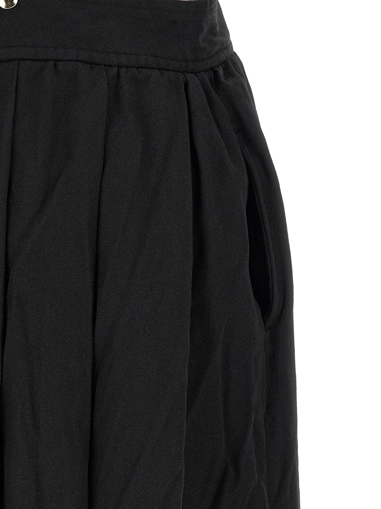 Skirt by Comme Des Garçons for unisex in polyester black features a contoured silhouette from the Unisex Flared Polyester Skirt collection, characterized by its contoured midi for a contoured finish.