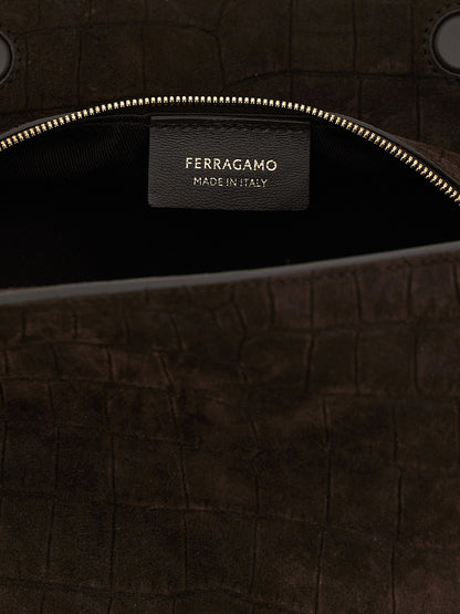 Shoulder Bag by Ferragamo for women in suede exotic leather brown features a enviable silhouette, showcasing a secure zipper & magnetic, ample , and enviable shoulder-strap & handle for a enviable finish.