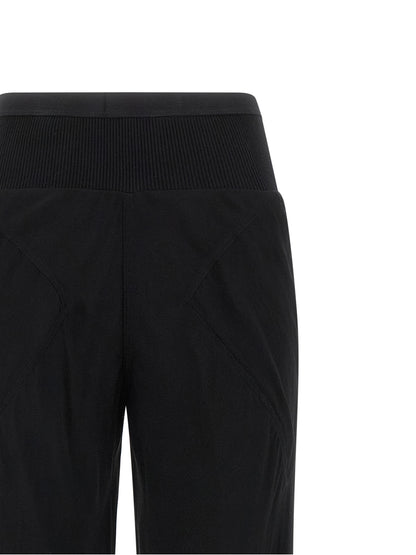 Trousers by Rick Owens for women in silk black & transparent features a tailored silhouette with a tailored flared, defined by its long and a sophisticated .