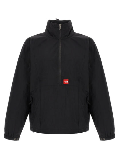Windbreaker Jacket by The North Face for men in nylon black & red presents a resilient silhouette, artfully detailed with a sophisticated high-neck neckline and functional pockets & windproof for a resilient finish.