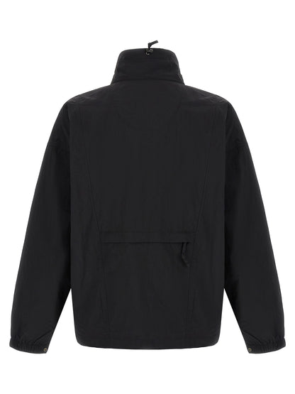 Windbreaker Jacket by The North Face for men in nylon black & red features an stylish silhouette, showcasing a sophisticated high-neck neckline and performance-driven pockets & windproof for a premium, stylish look.