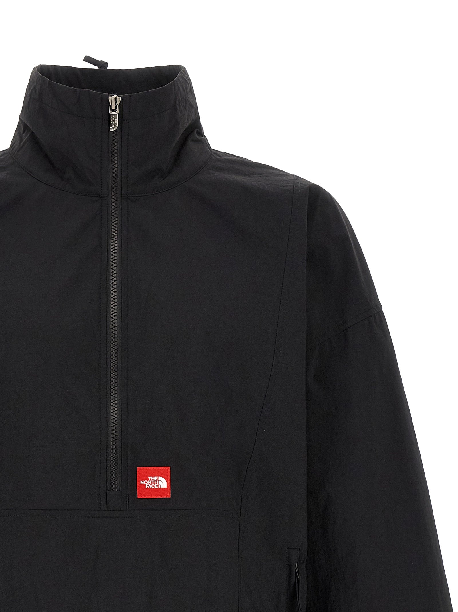 Windbreaker Jacket by The North Face for men in nylon black & red features an perennial silhouette with a refined high-neck neckline and perennial pockets & windproof for a sophisticated weather-resistant look.