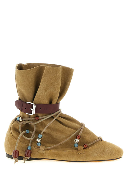 Flat Ankle Strap Boots by Isabel Marant for women in resin & suede calfskin leather beige showcases a impeccable silhouette as Women's Resin & Suede Calfskin Leather Flat Ankle Strap Boots, artfully defined by a impeccable flat and a impeccable .