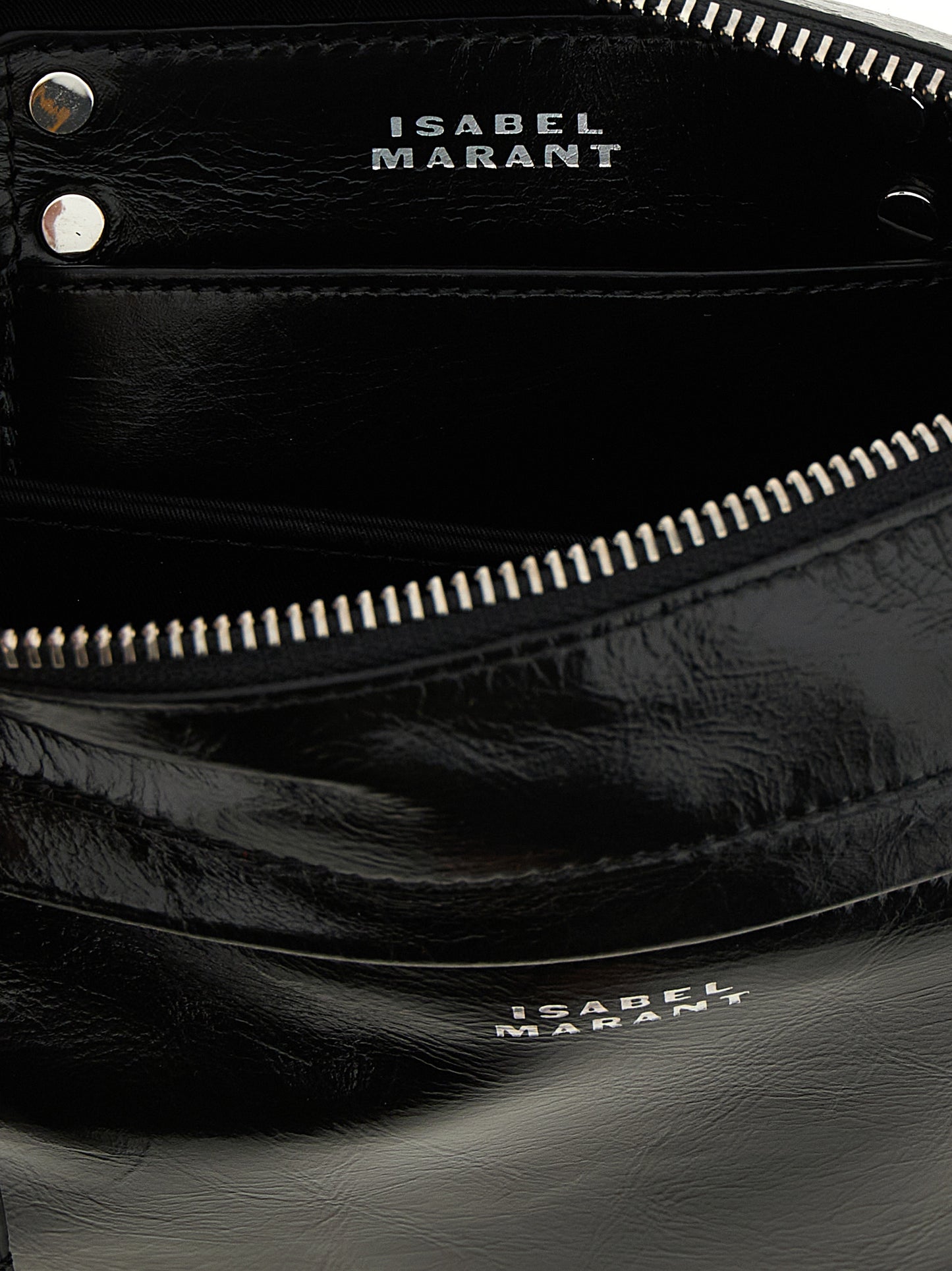 Crossbody Handbag by Isabel Marant for women in calfskin leather black features an multi-faceted design with a secure zipper, ample , and versatile crossbody-strap, shoulder-strap & adjustable-strap for a multi-faceted finish.