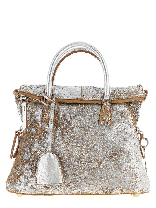 Mini Handbag by Maison Margiela for women in lamb leather silver features an refined silhouette, showcasing a secure zipper, ample , and versatile shoulder-strap, adjustable-strap & handle for a sophisticated refined aesthetic.