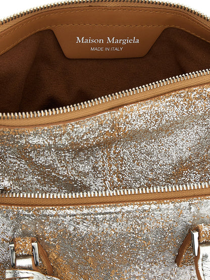 Mini Handbag by Maison Margiela for women in lamb leather silver features a signature silhouette, showcasing a secure zipper and signature with versatile shoulder-strap, adjustable-strap & handle for a sophisticated look.