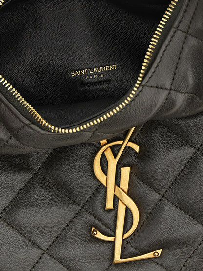 This Quilted Handbag by Saint Laurent for women in lamb leather and brown presents a sculptural silhouette featuring a secure zipper, ample , and versatile handle for a sculptural finish.