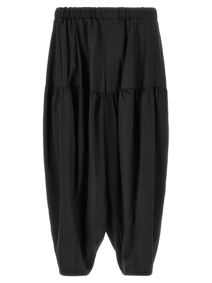 Trousers by Comme Des Garçons for men in polyester black features an on trend silhouette, showcasing a sophisticated with a long and for an on trend finish.