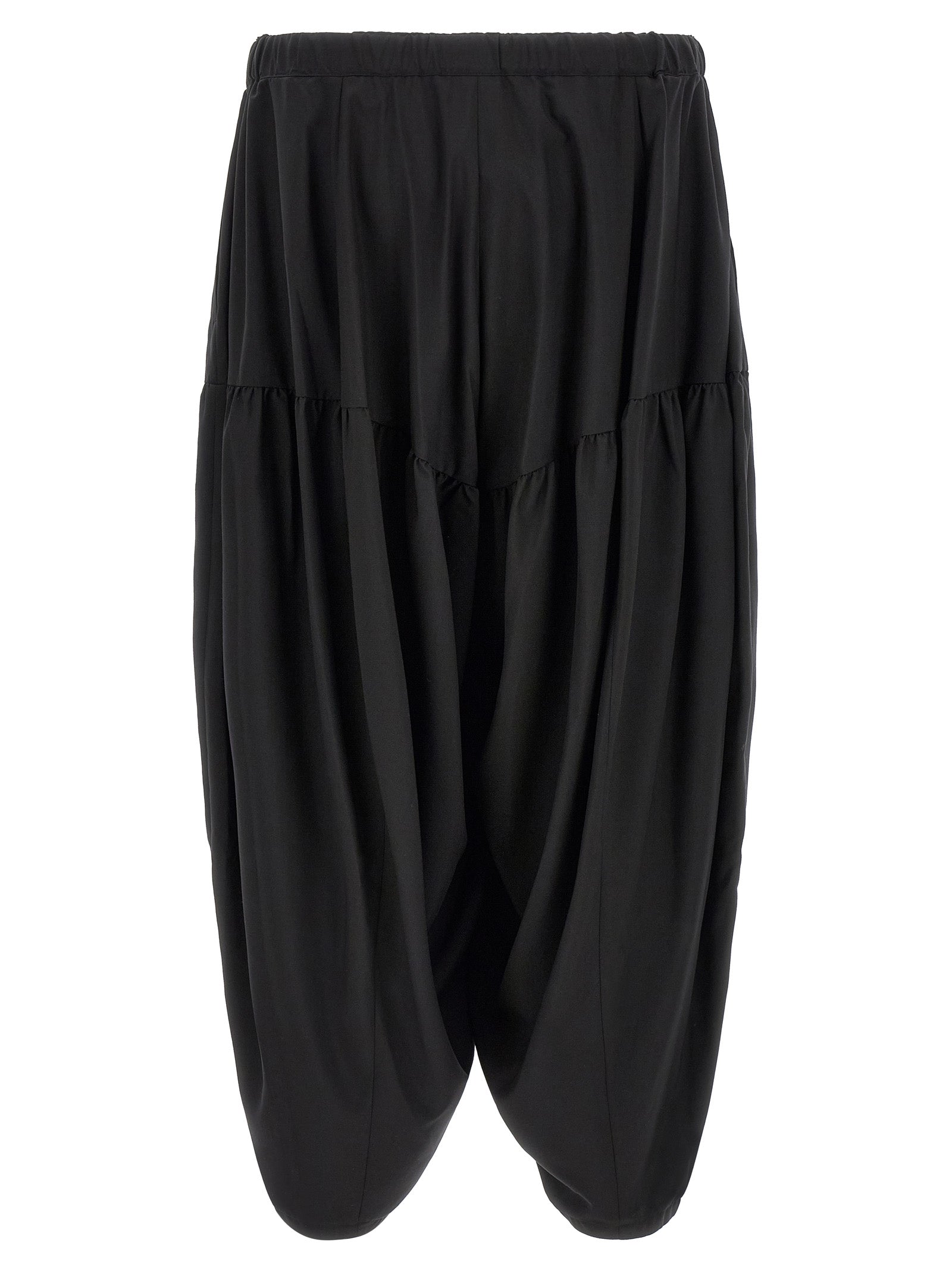 Trousers by Comme Des Garçons for men in polyester black features a sculptural silhouette, showcasing a sculptural and long with a sophisticated for a sculptural finish.