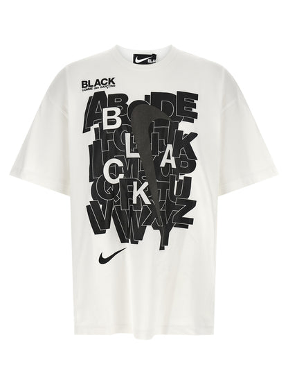 T-Shirt by Comme Des Garçons for men in cotton black, white & print showcases a dramatic silhouette, elegantly detailed with a dramatic crew neckline and for a truly dramatic finish.